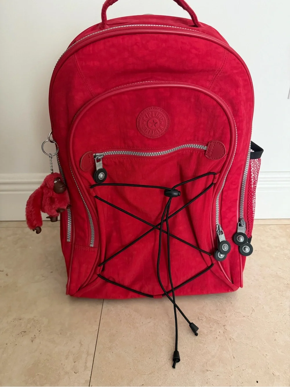Kipling Bright Red Rolling Backpack with Monkey Charm